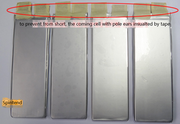 The incoming material with cell pole ears insulated by tape