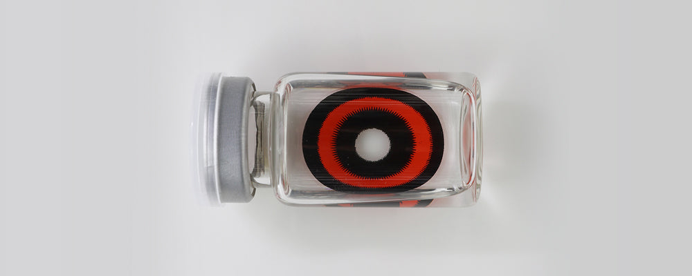 Black and red 22mm sclera contact lenses which entirely cover the sclera and iris