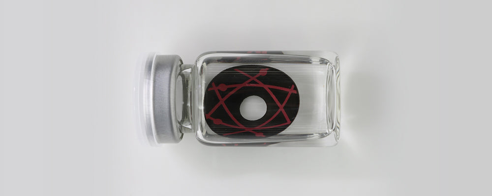 Black and red 22mm sclera contact lenses which entirely cover the sclera and iris