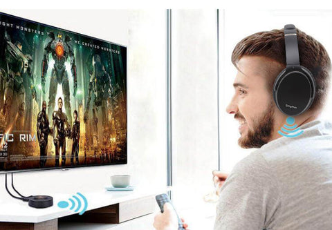 Man connecting Srhythm Headphones to the TV