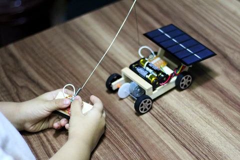 a kid is playing the car